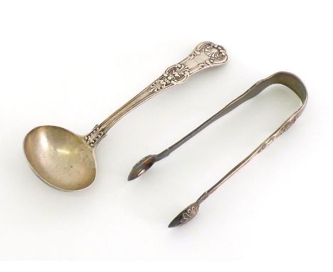 A Victorian silver Queens pattern sauce ladle by George Adams, London, 1846, engraved with demi-griffin rampant crest; also a