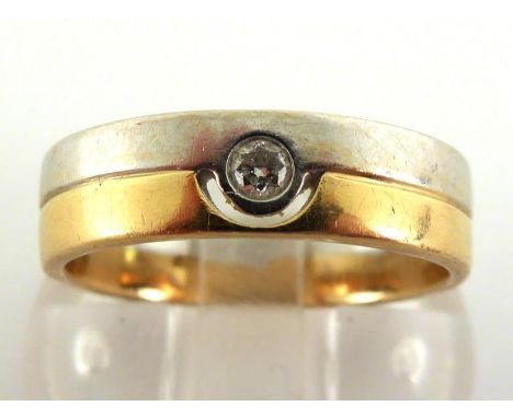 An 18 carat two colour gold and diamond ring, the rub over set diamond approx. 0.05 carats, the shank fully hallmarked, finge