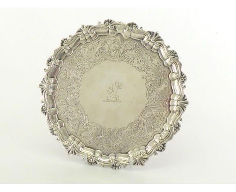 A George III Irish silver salver by William Townsend, Dublin, circa 1765, marked on top amidst decoration with maker's mark, 