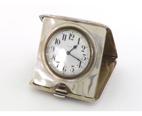An American silver 8-day clock by Black, Starr & Frost, New York, circa 1900, in folding flower and scroll-engraved case with