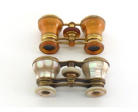 A pair of brass and terracotta guilloche enamel opera glasses by Asprey, London (one lens loose); and another pair, smaller b