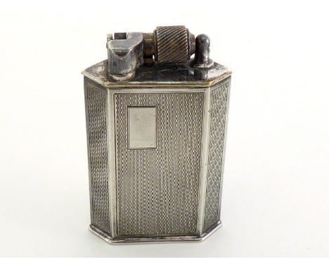 An Art Deco chrome lighter by McMurdo & Co., engine turned overall, 6.4cm high 