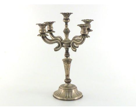 An Israeli white metal (tests silver) five-light candelabrum, stamped "833", tapering column on circular pedestal base, with 