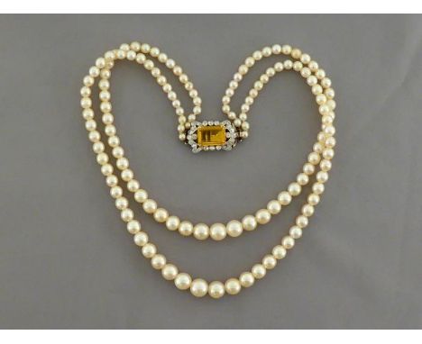 A two-strand cultured pearl choker, composed of two length strands, the shorter 37cm long, each of graduated 3.8 - 8.6mm, to 