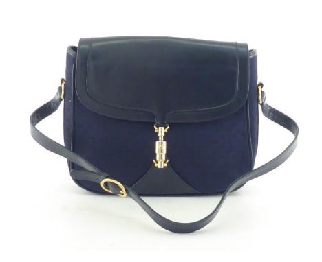A vintage Gucci monogrammed navy canvas and leather handbag with goldtone horsebit closure, probably 1970's. Beautifully line