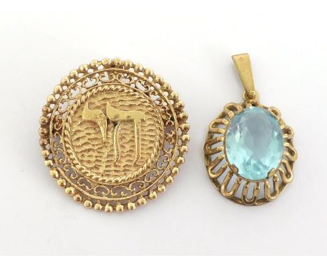 Two pendants, the first set with a blue paste, the mount stamped '333' (8 carat gold), 3.5gms, the second chai pendant stampe
