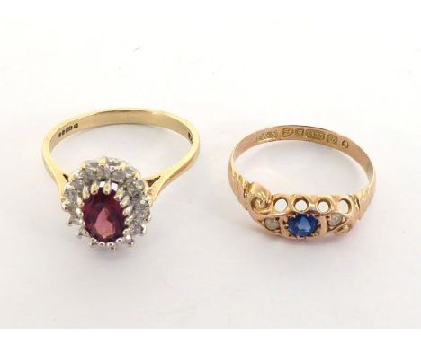 Two 9 carat gold rings, the first example set with a garnet topped doublet, the second with paste, 3.4gms gross 