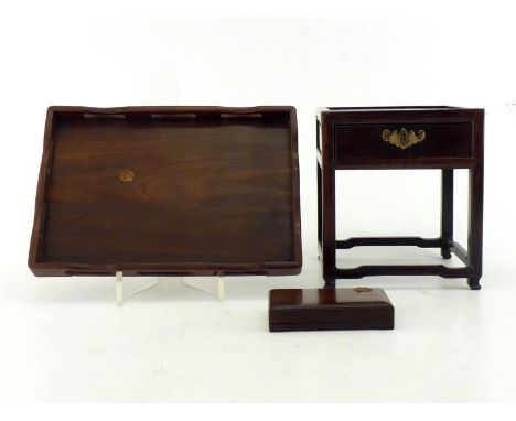 A group of three Chinese mahogany scholar's desk accoutrements, comprising a stand on four supports, with brass-mounted drawe