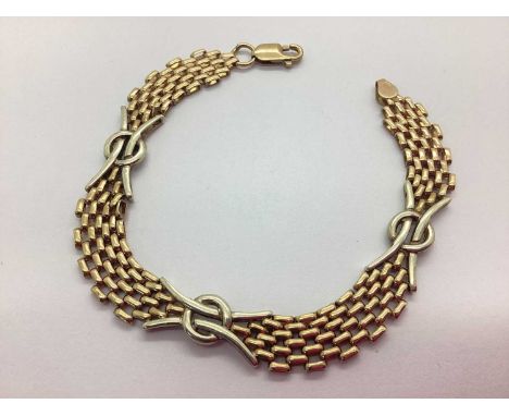 A 9ct Two-Tone Gold Fancy Link Bracelet, of gate link design with abstract style spacers, approximately 19cm long (12.6grams)