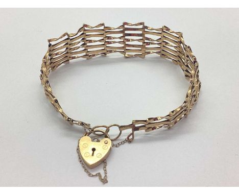 A 9ct Gold Gate Link Bracelet, of tapered design, to 9ct gold heartshape padlock clasp, approximately 17cm long (6.2grams).