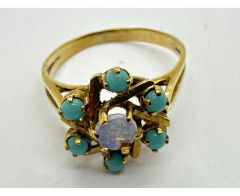 An Abstract Style Stone Set Dress Ring, allover circular claw set within abstract flowerhead design, between bifurcated shoul