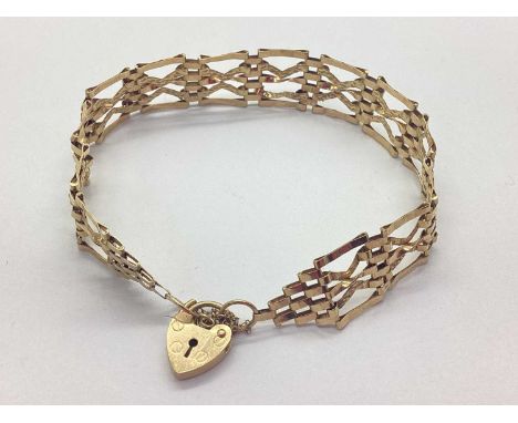 A 9ct Gold Fancy Gate Link Bracelet, of tapered design, to 9ct gold heartshape padlock clasp with safety chain, approximately