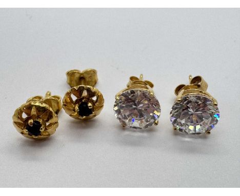 A Pair of Single Stone Earstuds, circular claw set to centre, stamped "18K"; Another Pair of Single Stone Earstuds, circular 