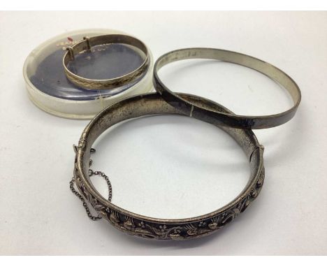 David Scott-Walker; A Hallmarked Silver Bangle, of plain design and baring feature hallmark, Sheffield 2000 Millenium mark, a