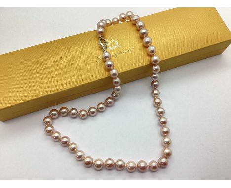 A Blush Coloured Pearl Bead Necklace, each pearl of uniform size, knotted to clasp stamped "925", in a Lao Feng Xiang necklac