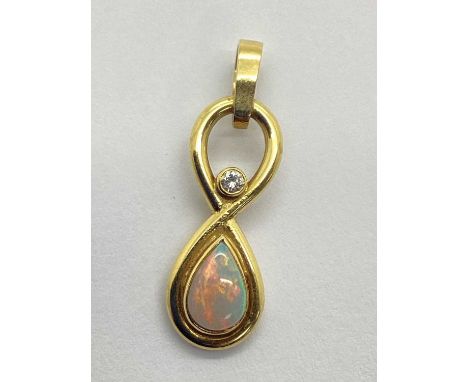 An 18ct Gold Diamond and Opal Drop Pendant, of sinuous openwork design with teardrop collet set highlights, approximately 3.5
