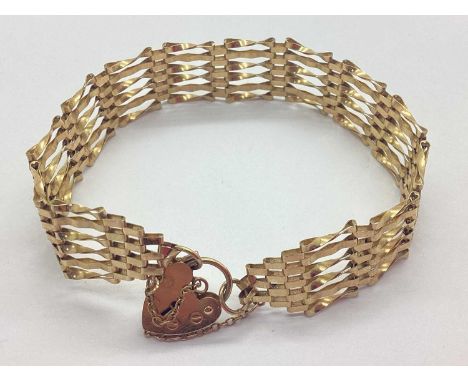 A 9ct Gold Gate Link Bracelet, of tapered design, to 9ct gold heartshape padlock clasp and safety chain, approximately 17cm l