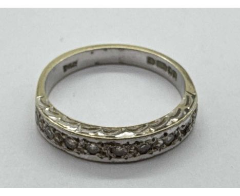 A 9ct Gold Diamond Half Eternity Style Ring, illusion set to decorative setting, between tapered band (finger size K) (2.3gra