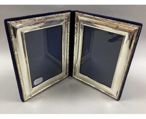A Hallmarked Silver Mounted Two-Sided Photograph Frame, MMH, Birmingham 1997, of rectangular form with reeded surround and cr