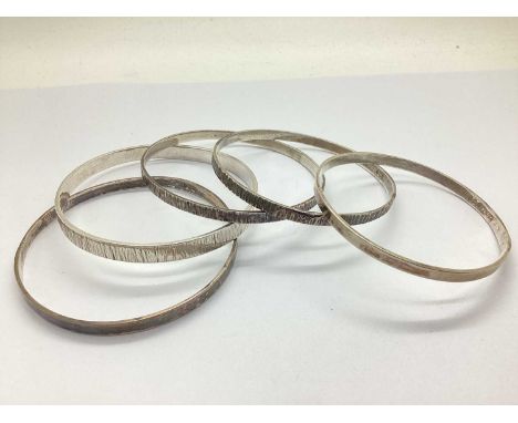 A Set of Three Hallmarked Silver Stacking Bangles, R.S.A, Sheffield 1969, including bark textured, hammered finish, plain; To