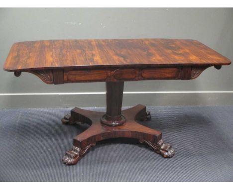 A William IV rosewood sofa table on lion paw feet (71.5 x 92 x 70cm closed)