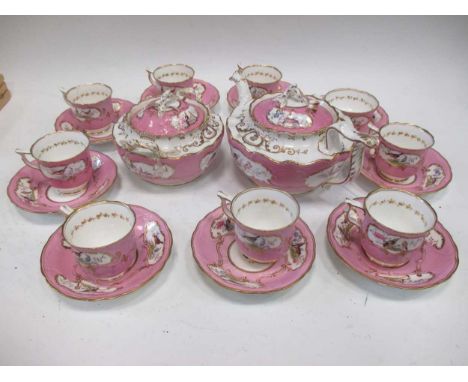 An English porcelain tea service, the pink ground reserved with shaped panels painted with birds, comprising teapot and cover