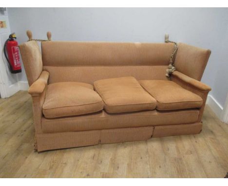 A yellow/buff upholstered Knowle sofa, 190cm wide
