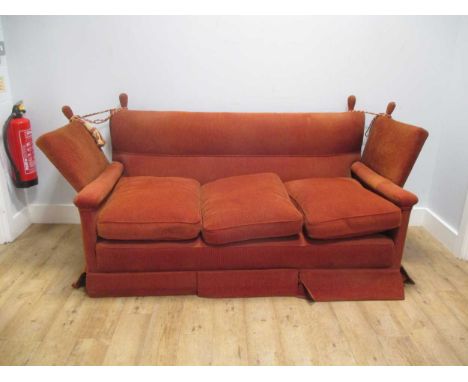 A red upholstered Knowle sofa, 190cm wide