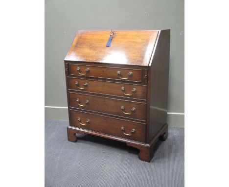 A George III style mahogany bureau with fitted interior over four graduating long drawers on bracket feet (with key), 98 x 76