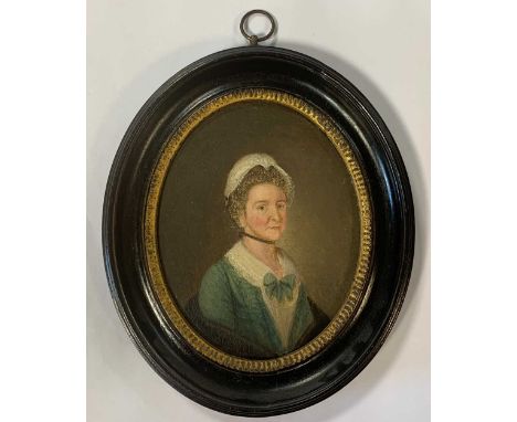 Portrait of Mrs M Poyning, aged 46, seated, in a green dress and a white bonnet inscribed to the reverse 'A Sketch by / Geo. 