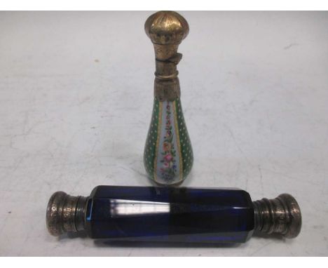 A 19th century gilt metal mounted and enamel perfume bottle, 10cm high; a Victorian blue glass double ended perfume bottle, 1