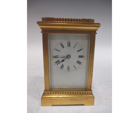 An early 20th century brass carriage clock, 16cm high including handle