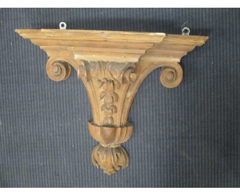 A carved pine wall bracket