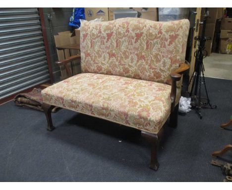 A George II style mahogany two-seater sofa, with serpentine back and curved arm rests, 128cm wide