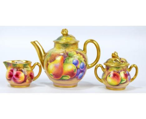 A small Royal Worcester fruit painted teapot and cover, a fruit painted gilt heightened small twin handled sugar bowl, both b