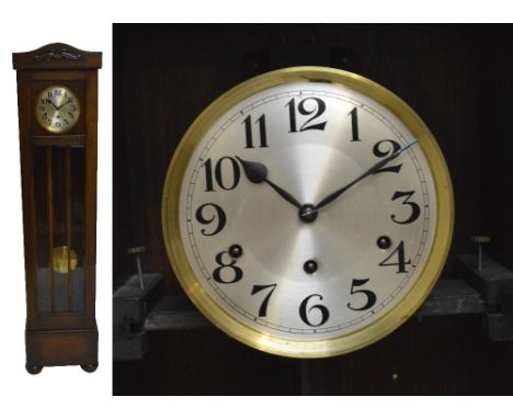 A 1920s oak cased eight day chiming longcase clock, with bead decoration, the circular dial set with Arabic numerals, height 