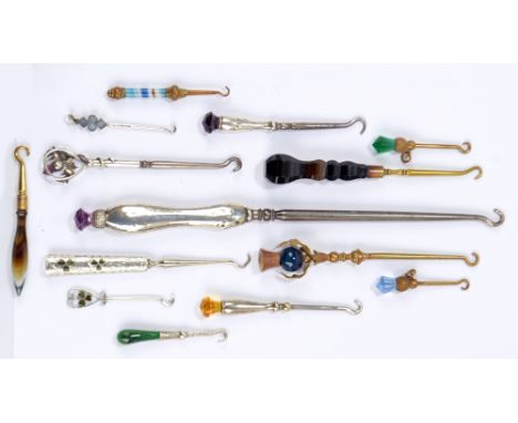 A collection of silver, hardstone and glass handled button hooks, including a small hook and a glove hook both decorated with