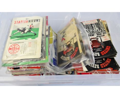 A collection of football programmes from the 1940s to the 1970s including Manchester City and United, Arsenal, FA Cup Finals,