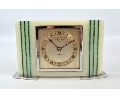 GARRARD & CO LTD; an Art Deco alabaster and malachite detailed 'Elliot' mantel clock, the circular chapter ring set with Roma