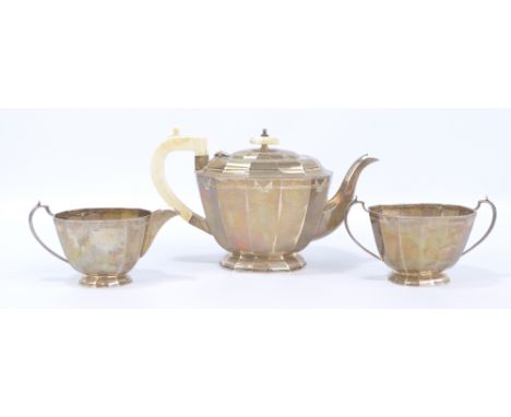 VINER'S LTD; a George V hallmarked silver Art Deco three piece tea set of panelled form, each piece with engraved detail, She