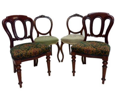 A pair of Victorian mahogany balloon back dining chairs with padded stuff over seats and ring turned front legs and a pair of