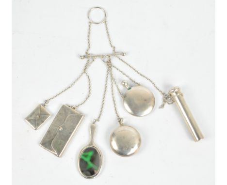 An interesting silver chatelaine supporting a stamp box in the form of an envelope, a further container in the form of a purs