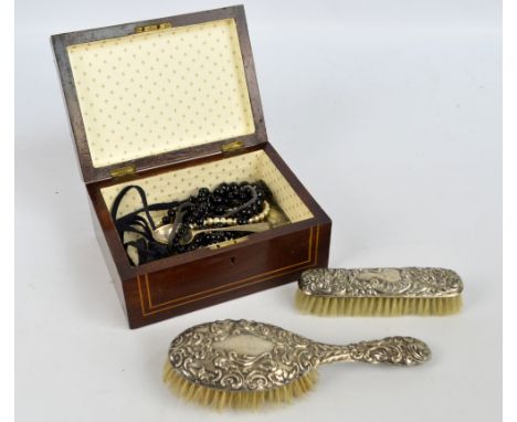 An Edwardian mahogany and inlaid jewellery box containing a small group of costume jewellery, a Georgian silver spoon, etc, a