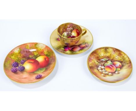 A small Royal Worcester fruit painted cup and saucer, the saucer signed S.Roberts, the interior of the cup signed J. Sewell, 