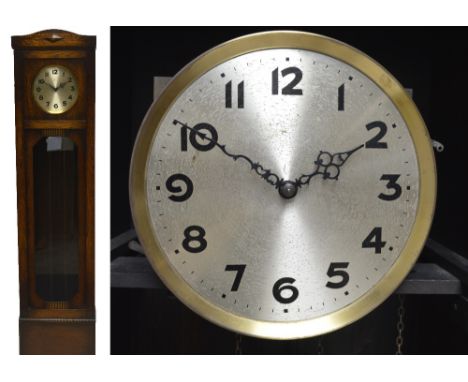 A 1920s oak longcase clock, the circular dial set with Arabic numerals, on turned bun feet, height 190cm.