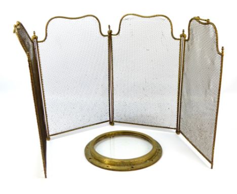 A three-fold mesh fireguard and a vintage brass glazed porthole (2).
