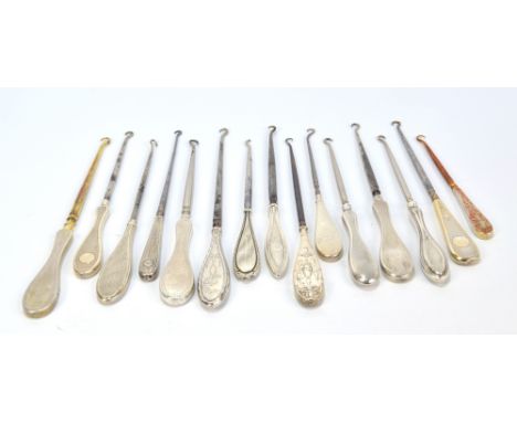 Fifteen medium sized button hooks with hallmarked silver sheath flat handles, mostly with engine turned decoration, one plain