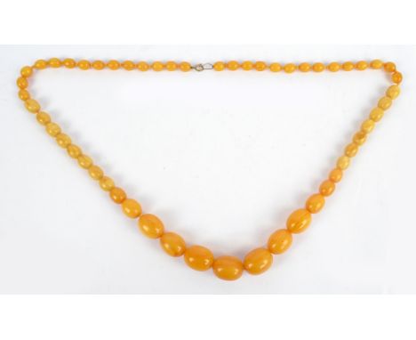 A pale green jade graduated bead necklace with 9ct gold clasp, length 75cm.