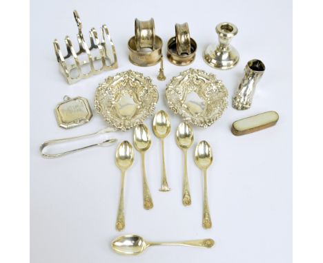 A group of variously hallmarked silver items to include a four division toast rack, James Dixon & Son, Sheffield 1918, length