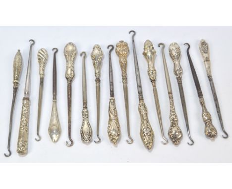 Fifteen small button hooks with hallmarked silver sheath handles, including a bright cut example with finial and vacant carto
